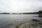 Norwegian fjords and mountains. Rocky shore, waves and trees