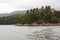 Norwegian fjords and mountains. Rocky shore, waves and trees