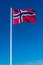 Norwegian flag on the blue sky