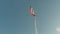 Norwegian flag, pennant, on flag pole in cold breeze in winter sunshine