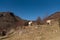 Norwegian horses known as fjord horses are seen in the wild in among mountains running free and eating in group in pristine