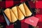 Norwegian Krumkake cookies on a black ceramic plater, holiday tablecloth, red note to Santa
