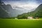 Norwegian landscape with typical scandinavian houses  in the valley. Idyllic landscape farm in Norway. Rural view