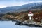 Norwegian lighthouse. White tower with red top