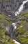 Norwegian mountain road. Waterfall and stone bridge. Trollstigen. Stigfossen. Norway