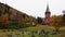 Norwegian red church Hol kyrkje at Hagafoss in Buskerud Norway in autumn