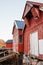 Norwegian red wooden barns standing on coast