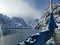 Norwegian sailing trollfjord and coast during a winter sail with snow