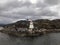 Norwegian seascape with tiny white lighthouse on rocks. Northern sea landscape, Norway, Scandinavia