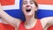 Norwegian Young Woman Celebrating while holding the Flag of Norway in Slow Motion