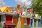 NORWICH, UK - JUNE 4, 2017: The colorful stalls of the open-air market marketplace with the Guildhall in the background