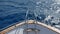 Nose bow of the yacht, boat or ship dissects blue sea waves 4k