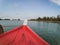 Nose of fiber boat sailing to the island.