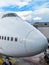 Nose of a large white aircraft at an airport