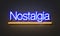 Nostalgia neon sign on brick wall background.