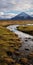 Nostalgic Romanticism: A Mountain Field Alongside A Serene Stream