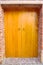 Nostalgic wooden door and red brick wall