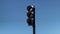 Not working or turned off triple black traffic light isolated on blue sky background