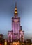 Notable illuminated Palace of Culture and Science high-rise building in Warsaw, Poland at night