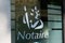 Notaire french notary sign logo on windows entrance building office