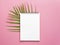 Note book on the palm leaves. On pink background For design. Mock up or add text