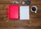 Note book and pencil with cup coffee on wooden table