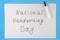 A note with an inscription is a national day of hand writing and a marker.