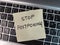 A note showing the phrase Stop Postponing