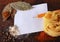 Note,spices and pasta on a wood cutting board