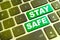 Note STAY SAFE writting on green button on computer keyboard. Stay safe key on computer keyboard prevention message