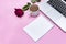 Notebook, 1 Cup of black coffee, laptop keyboard, purple rose flower on pink