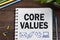 Notebook with a Business notes CORE VALUES on the office table w