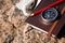 Notebook, compass, rope on stone background