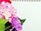 Notebook diary and beautiful artificial Hydrangeas flower bouquet background