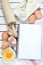 Notebook , eggs, flour and rolling pin