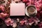 notebook, flowers and coffee over the pink table