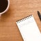 Notebook with inscription Goals and Cup of coffee on the wooden