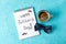 Notebook with inscription happy fathers day, blue bow tie and cup of coffee on color background, space for text