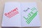 Notebook pages with the words `restart your life` in red, black, green.