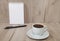 Notebook, pen and coffe, wooden background