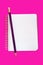 Notebook with Pencil on Pink
