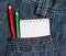 Notebook and pencils in jeans pocket