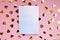 Notebook on a pink background, confetti. Place for text. Festive background. Event. The concept. Flat lay. Top view