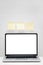 Notebook with place for copy space on a white wooden background with yellow stickers. Vertical