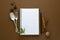 Notebook for recipes, mock up. Open notebook and food condiments, fork and spoon. Anise star, cinnamon sticks, mint
