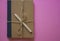 Notebook tied with burlap rope bow on pink table Wooden pencil for drawing notes