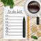 Notebook with to do list, fir tree branches, cookie, a pencil