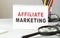 Notebook with Toolls and Notes about Affiliate Marketing