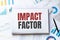 Notebook with Tools and Notes about impact factor,concept