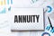 Notebook with Tools and Notes with text ANNUITY